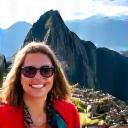 A woman smiling with Machu Picchu in the background.