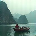 A solo traveler on a boat in Ha Long Bay, Vietnam.